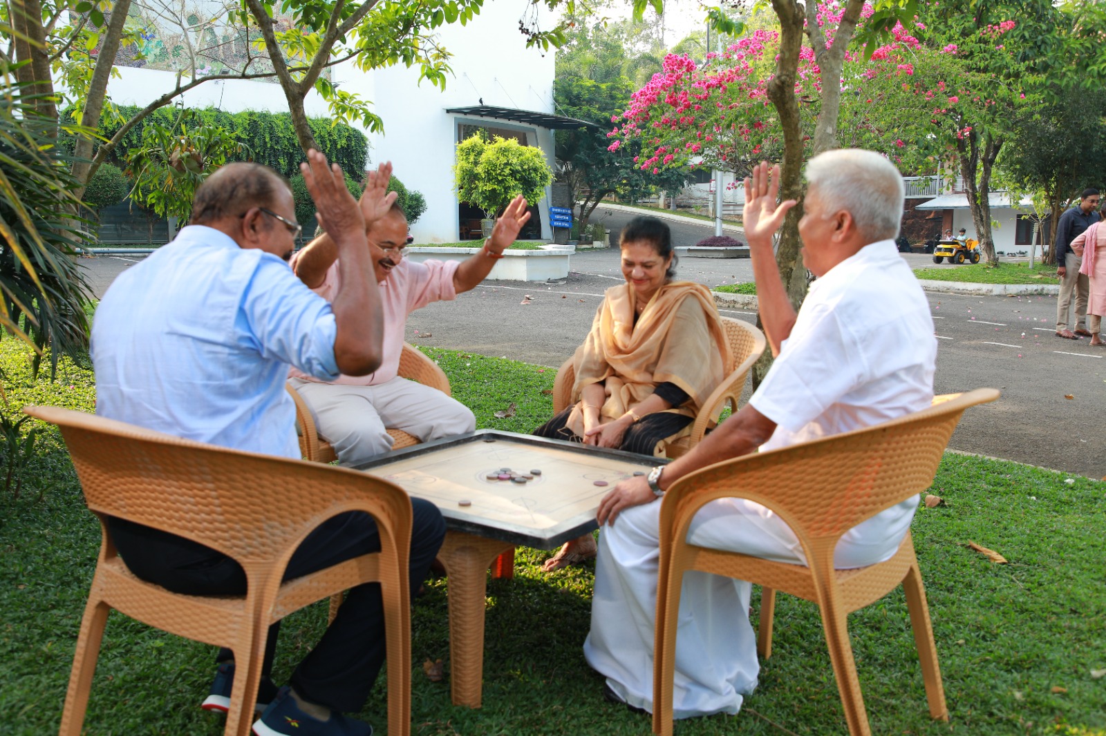 Residents celebrating while playing a game outdoors